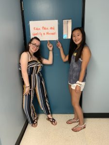 Ashlie German and Emma Crockerposing outside our classroom on the last day of class